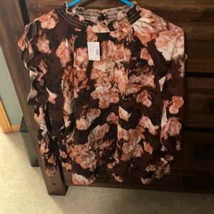 Brown rusty colored floral high neck open flutter sleeve top.